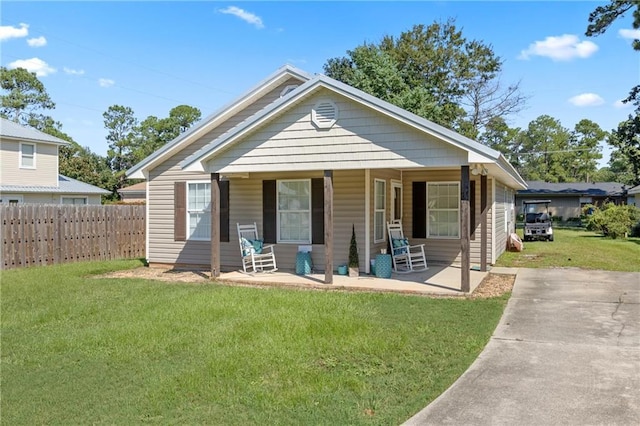 bungalow-style house featuring a porch and a front yard