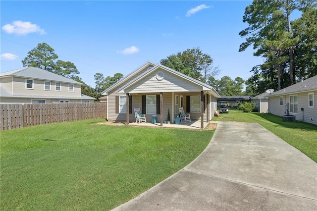 bungalow-style home with a porch and a front lawn