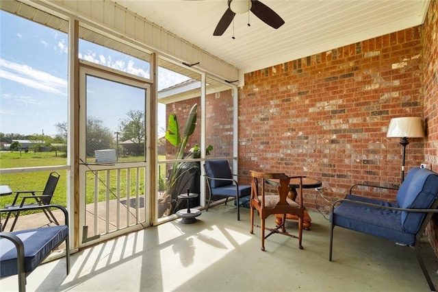 sunroom with ceiling fan and a healthy amount of sunlight