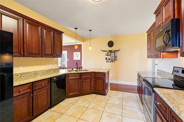 kitchen with light tile patterned floors, hanging light fixtures, a sink, a peninsula, and black appliances