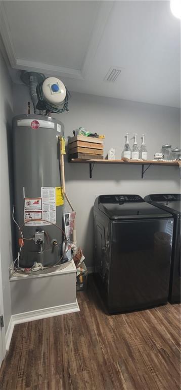 13556 James Copeland Dr, Mobile, AL 36695 - laundry area with water heater, washing machine and clothes dryer, and wood finished floors