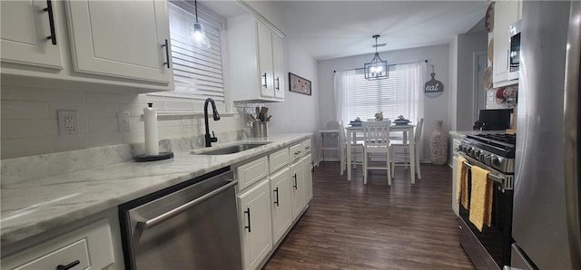 13556 James Copeland Dr, Mobile, AL 36695 - kitchen with appliances with stainless steel finishes, white cabinets, backsplash, and dark wood finished floors