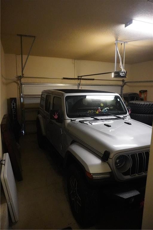 garage featuring a garage door opener