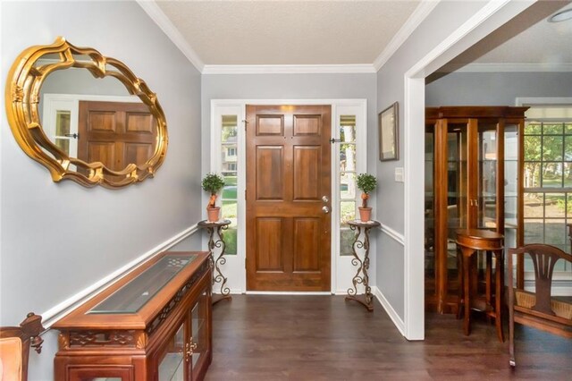 entrance foyer featuring crown molding, baseboards, and dark wood finished floors