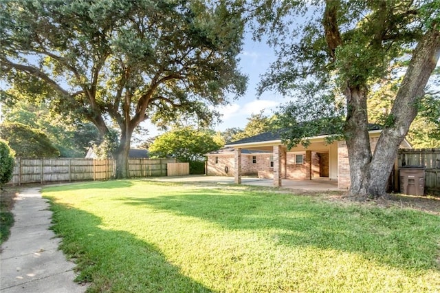 view of yard with a patio area and fence