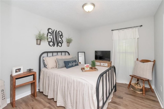 bedroom featuring wood-type flooring