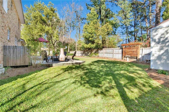 view of yard with fence and a patio area