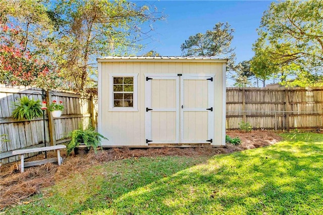 view of shed featuring a fenced backyard