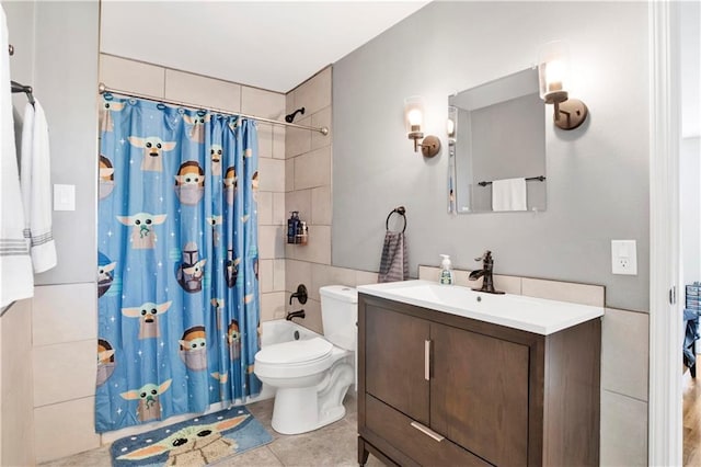 bathroom with shower / bath combo with shower curtain, toilet, tile patterned flooring, and vanity