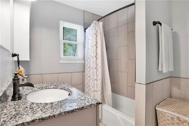 full bathroom with shower / bath combo and vanity