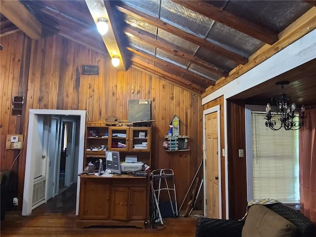 interior space featuring wood walls, wood finished floors, a chandelier, and lofted ceiling