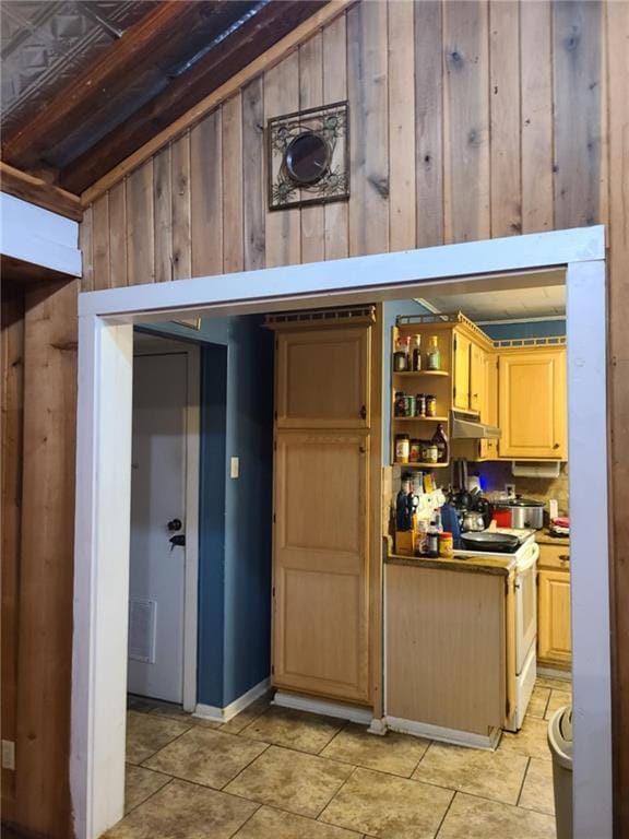 kitchen featuring white range with electric cooktop, open shelves, under cabinet range hood, wooden walls, and light brown cabinets
