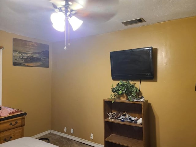 bedroom with visible vents, baseboards, and a ceiling fan