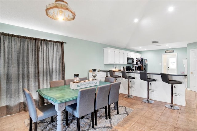 dining space with light tile patterned floors