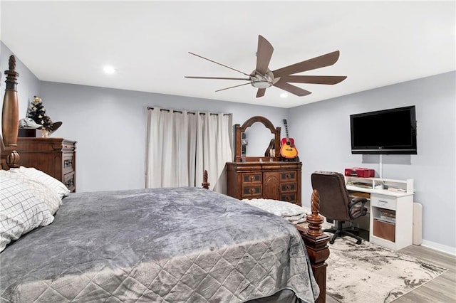 bedroom featuring wood-type flooring and ceiling fan