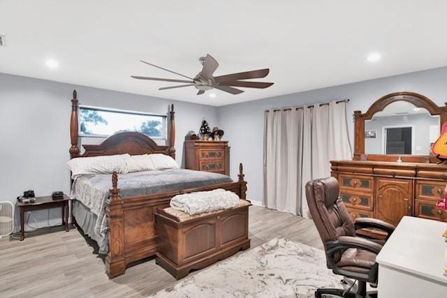 bedroom featuring ceiling fan and light hardwood / wood-style flooring