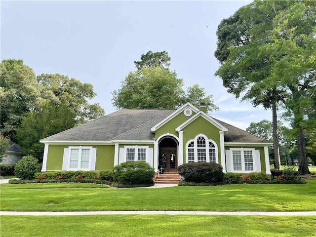 9849 Aspen Cir, Daphne, AL 36527 - view of front of property featuring a front lawn, stucco siding, roof with shingles, and french doors