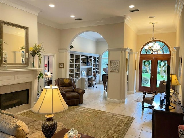 9849 Aspen Cir, Daphne, AL 36527 - entrance foyer featuring arched walkways, healthy amount of natural light, light tile patterned floors, a chandelier, and recessed lighting