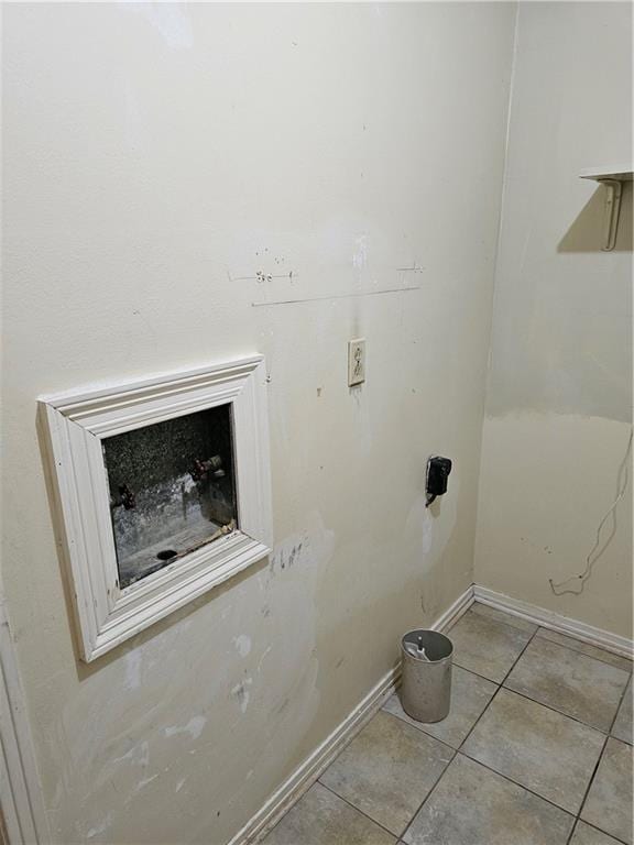 washroom with light tile patterned floors