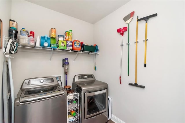 washroom featuring washing machine and dryer