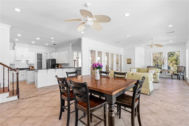 dining space with recessed lighting, crown molding, light tile patterned floors, ceiling fan, and stairs