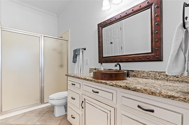 full bathroom with a shower stall, crown molding, toilet, tile patterned floors, and vanity