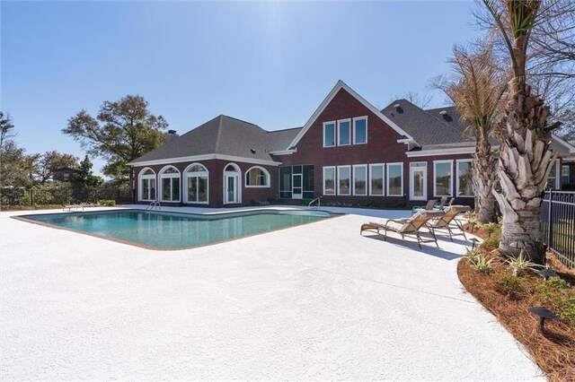 view of swimming pool with fence, a patio area, and a fenced in pool