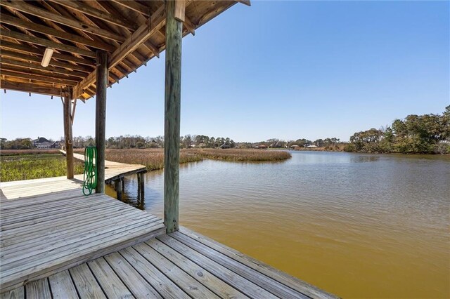 view of dock with a water view