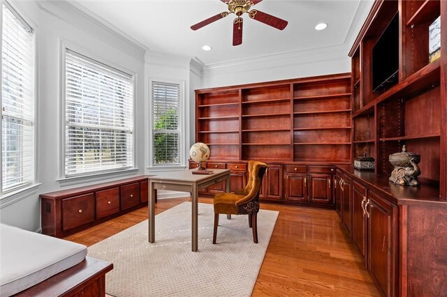 office space featuring recessed lighting, a ceiling fan, light wood-style flooring, and crown molding