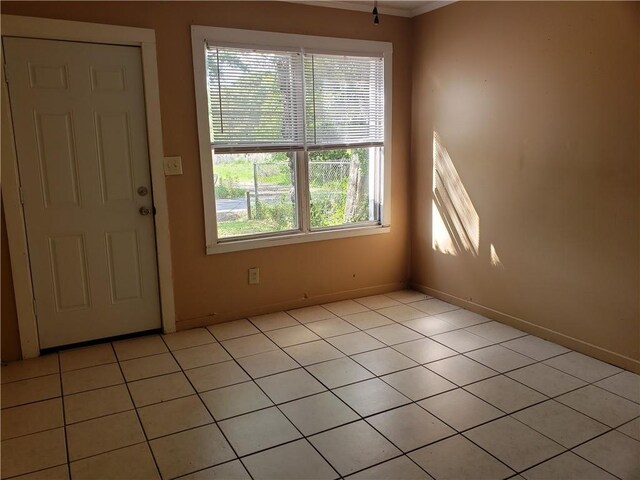 foyer featuring baseboards