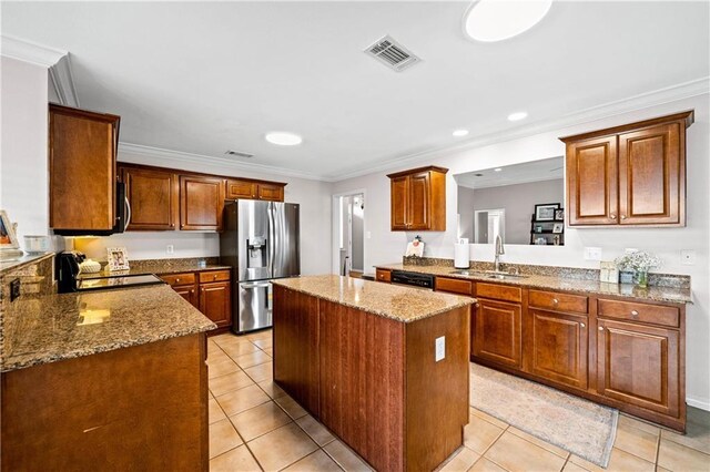 kitchen with a center island, crown molding, sink, and stainless steel appliances