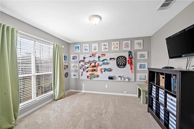 recreation room with light carpet