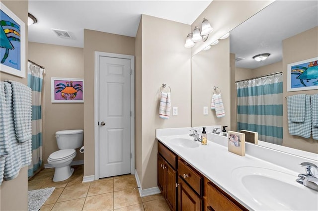 bathroom featuring tile patterned floors, curtained shower, vanity, and toilet