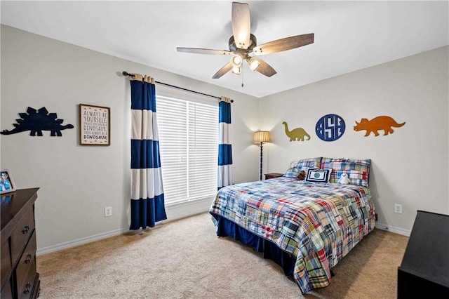 bedroom featuring ceiling fan and light carpet