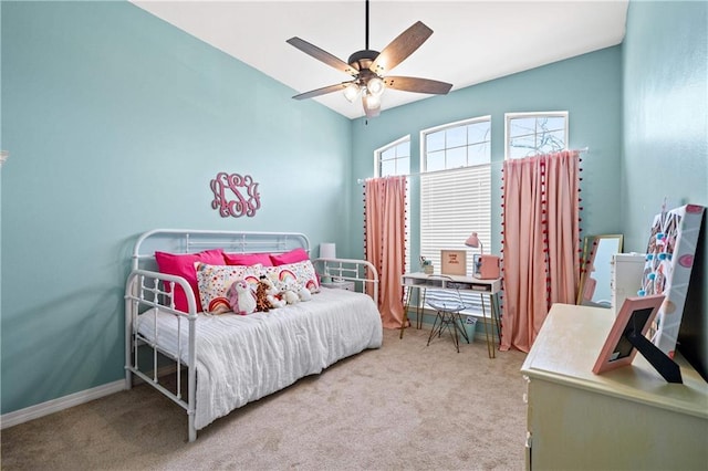 carpeted bedroom featuring ceiling fan and vaulted ceiling