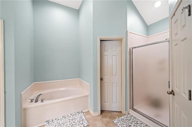 bathroom with tile patterned flooring and plus walk in shower