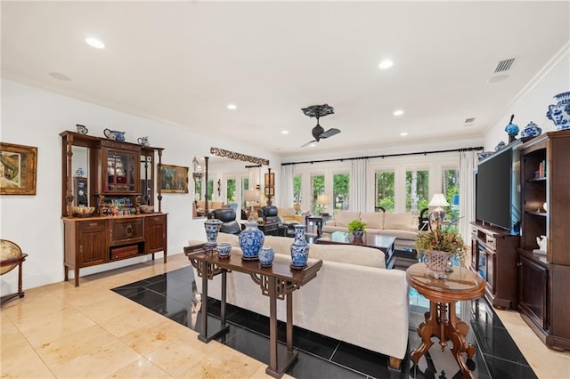 tiled living room featuring french doors and ornamental molding