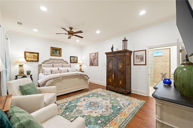 bedroom featuring ornamental molding, ceiling fan, and hardwood / wood-style flooring