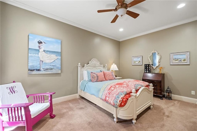 carpeted bedroom with ornamental molding and ceiling fan