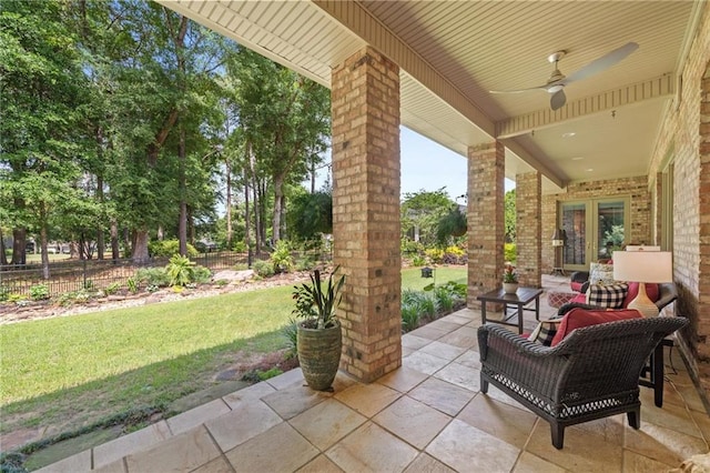 view of terrace with ceiling fan and outdoor lounge area