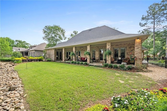 back of house featuring a yard