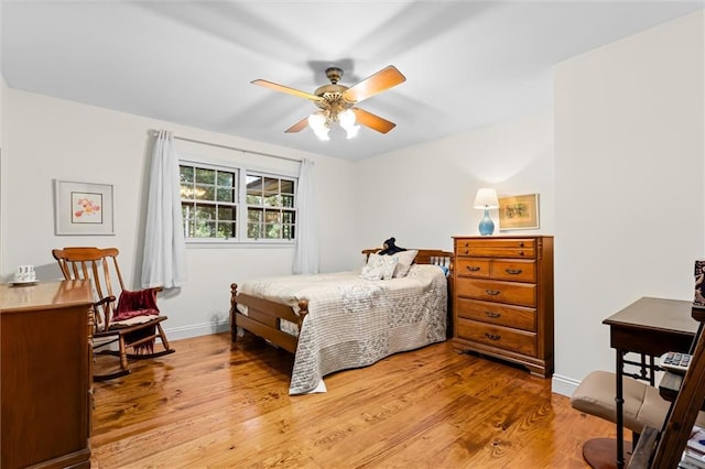 bedroom featuring light hardwood / wood-style flooring and ceiling fan