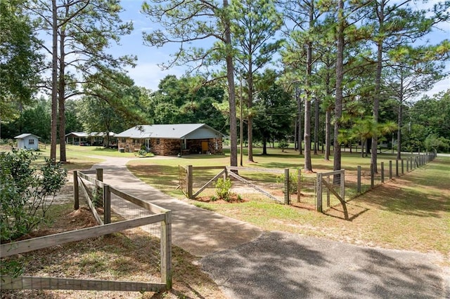 view of property's community featuring a yard