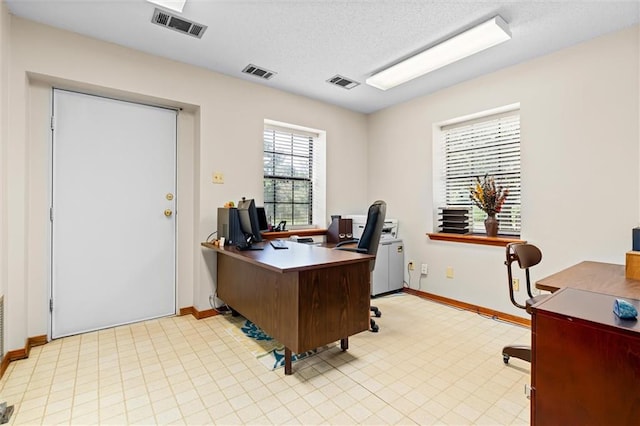 office space featuring a textured ceiling