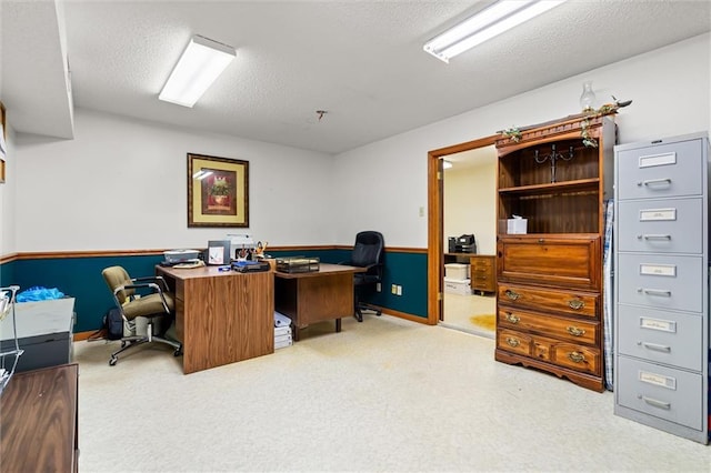 home office featuring a textured ceiling