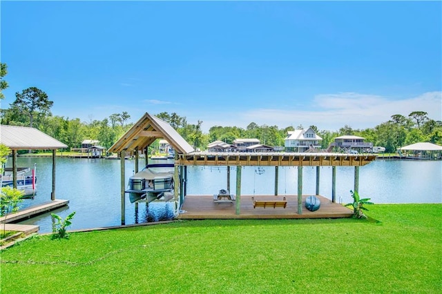 view of dock featuring a lawn and a water view