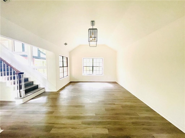 unfurnished living room with dark hardwood / wood-style floors and lofted ceiling