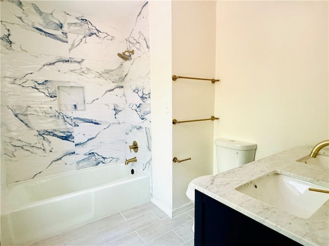 full bathroom with tile flooring, vanity, toilet, and tiled shower / bath