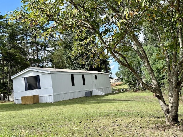 view of property exterior with a lawn