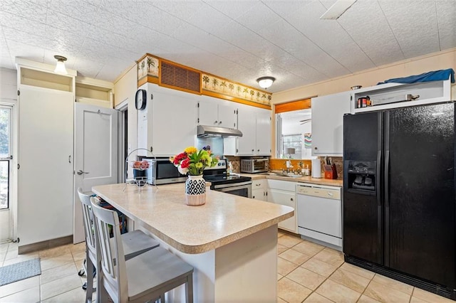 kitchen featuring under cabinet range hood, white cabinetry, stainless steel appliances, a toaster, and light countertops